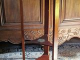 a wooden table with a glass top in a room