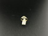 a gold ring with a white stone in the middle of it