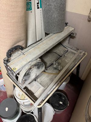 an image of a dirty bathroom with a lot of stuff on the floor