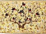 many birds sitting on the branches of a tree