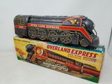two toy trains sitting on top of each other