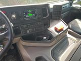 a car dashboard with a steering wheel and dashboard controls