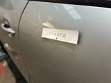 a sticker on the door of a car that says otusy