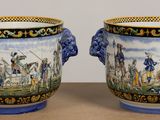 two vases that are sitting on a table