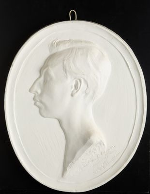 a close up of a white plate with a woman ' s profile on it