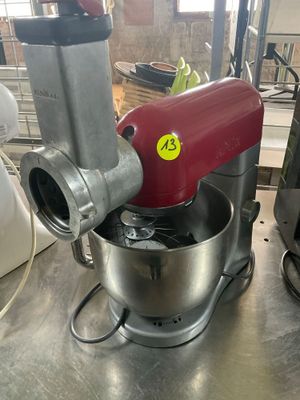 a red mixer that is sitting on a table