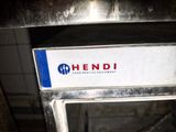 a sign that says hendi on the side of the oven