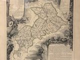 an old map of france with a man on a horse in the foreground