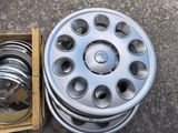 a box of silver rims and a box of silver rims