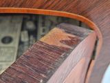a close up of a wooden table with a clock on it