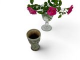 a vase of flowers and a cup of coffee on the table