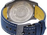 a close up of a wrist watch with a blue strap