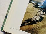an open book with a picture of a plane on it