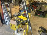 a yellow cart with a hose and a yellow cart with a hose in it