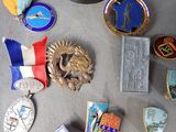 a lot of medals that are laying on a table