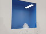 a picture of a blue room with a cloud in the window