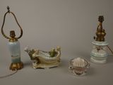 three different types of porcelain lamps are displayed on a table
