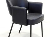 a black chair that is sitting on a white surface