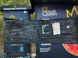 a pizza kiosk on the side of the road