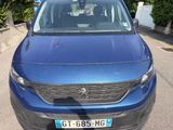 a blue car that is parked on the side of the road
