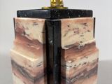 marble bookends with a golden trophy on top of them