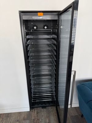 an image of a refrigerator with many trays of food inside of it