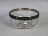 a close up of a glass bowl on a white surface