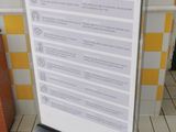 a sign that says stay safe in a public restroom