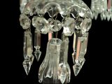a crystal chandelier hanging from the ceiling