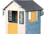 a little house with a weather vane on top of it