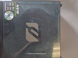 two cds and a cd case sitting on a table