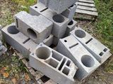 a pile of cinder blocks sitting on top of a pile of wood