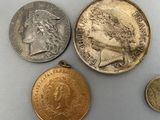 three different types of coins on a table with a coin in the middle