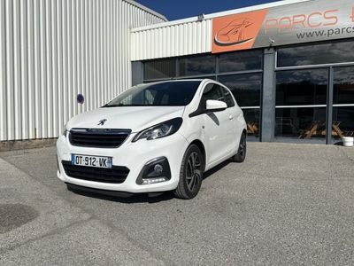 a white car parked in front of a building