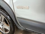 a close up of a car ' s tire on the ground