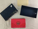 three different types of wallets are sitting on a white surface