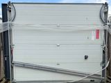 a picture of a garage door with a hose attached to it
