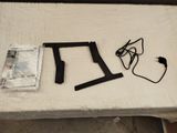 a table with a laptop, headphones, and other items on it