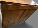a wooden cabinet with a drawer on top of it