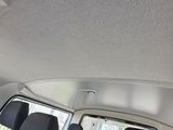 a view of the inside of a car from the back seat