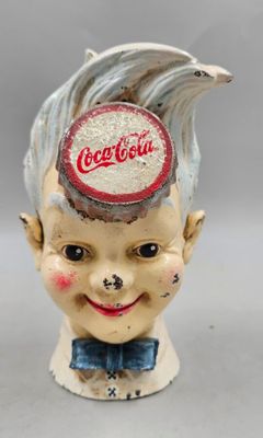 77 / J2 / Figurine publicitaire Coca-Cola en fonte des…