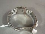 a close up of a watch on a table on a table