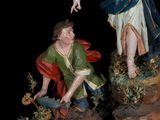 an image of a statue of an angel and a boy on a rock