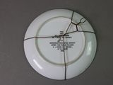 a white plate with a brown string around it