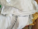 a cardboard box filled with clothes and a tag on it