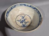 a blue and white bowl sitting on a table