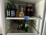 a refrigerator filled with lots of bottles of alcohol