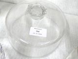 a glass container with a label on it sitting on a counter