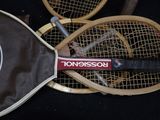 two tennis rackets that are laying next to each other