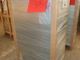 several pallets of plastic are stacked on top of each other in a warehouse